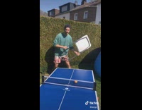 Guy plays ping pong with random things 
