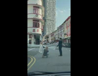 Woman in wedding dress in the middle of the street