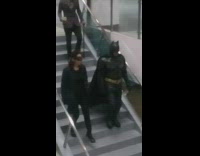 batman batwoman costume walking down stairs