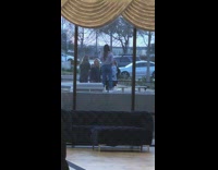 Group women hold cup outside spa window