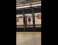 Guy does Michael jackson dance across subway station