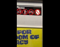 Woman sticks no trump sign on subway