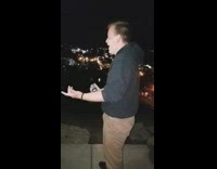 NSFW Black Hoodie Khaki Pants Breaks Beer on Head