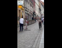 Woman colorful dress photoshoot middle of walkway