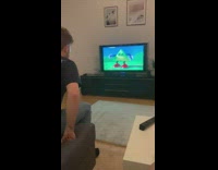 Guy dancing with cartoon on tv