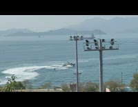 White boat chases jet ski across ocean 