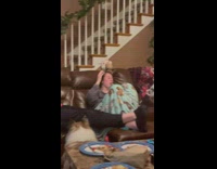 Dog runs around couch kisses everyone