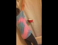 Girl blue shirt pours bowls of cold ice water over shower while mom girl lady showers