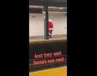 Santa Claus walks in subway station, and they said santas not real