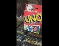 Collab BitchIG2 - Guy looking at Uno card  game and Uno Minimalist 