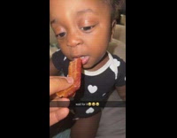 Baby tries bacon for first time 