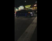 Biker police officer arrests guy on sidewalk for provoking blue car 