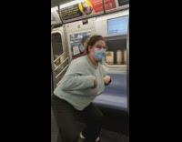 Woman act like chicken glasses sweater subway 