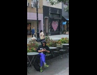Guy walking with giant stereo size of himself