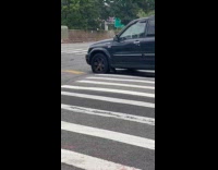 Collab WINY - Person drives black car with front flat tire