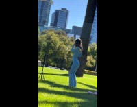 Woman blue outfit tiktok dance at park