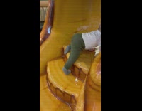 Baby falls off slide on his head 