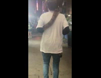 Snake wrapped on right shoulder of man