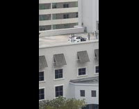 Woman dance in front of car rooftop 
