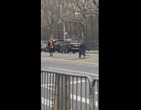 Girl posing in street walks towards photographer