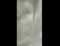 Long skinny tornado cyclone hurricane in sky 