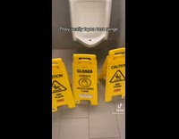 Collab BitchIG2 - Urinal surrounded by three yellow wet floor signs