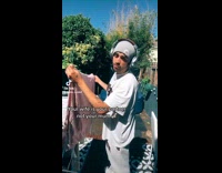 Bearded Man Does Chores as He Sings