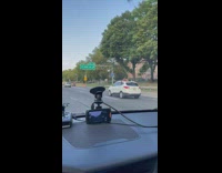 Shirtless man on car roof at highway