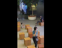 Son photograph mom sit on wooden box
