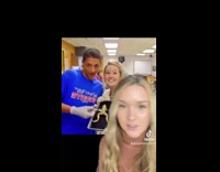 Girl goes through old yearbook pictures