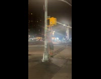 Collab WINY - Shirtless man do pull ups on traffic light