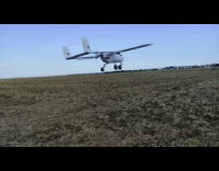 UAV plane fly over fields beside car