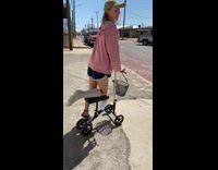 Girl on scooter for broken leg falls on curb