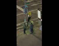 Two guys do pull ups at stop light