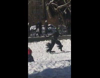 Alien wears all black costume at park