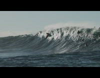 Guy surfs wave then falls off board