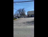 Man in santa costume rides bike in middle of spring
