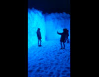 Girl uses two phones to photograph friend 