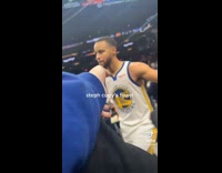 Woman receives famous athletes arm band and towel