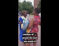 Mom hugs graduating daughter 