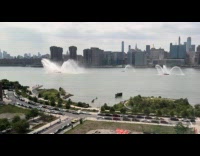 Ships on river shoot up some water