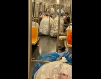 Bottles and cans in plastic bag in train