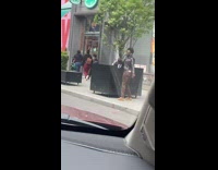 Guy Dances with Colorful Fan 