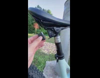 Man put batteries adjust setting of custom bike