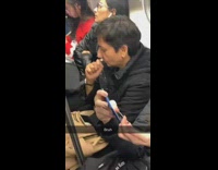 Woman secretly tweezes and plucks hairs on face with tweezers on subway train