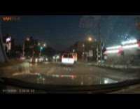 Truck stuck on pedestrian island at intersection 