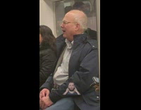 Old man on subway train sings opera out loud