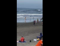 Lady poses on beach shore studio lights 