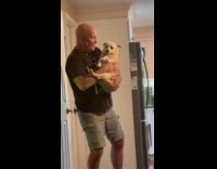 Dad bald man dance carry pet dog