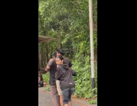 Three guys doing a rally race and guy stares down